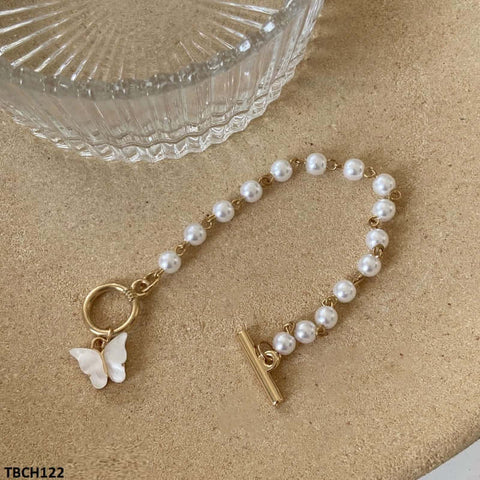 Stay trendy and elegant with our TBCH122 JMN Pearl Butterfly Bracelet. Made of high-quality fashion jewelry materials, this artificial bracelet is a perfect fashion accessory for any occasion. Handcrafted and uniquely designed by TJ Wholesale Pakistan, this bracelet is a must-have for any fashionista. Elevate your style with our CBCH bracelet today.