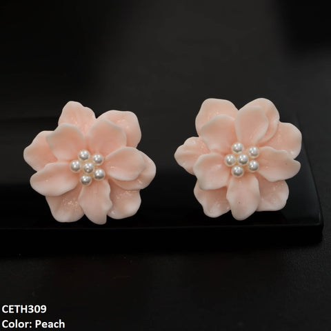 Complete your look with these elegant CETH309 YYE Painted Flower Stud Tops Pair. Made from high-quality fashion jewelry, these beautifully designed artificial earrings will enhance any outfit. The perfect addition to your fashion accessories collection. From TJ Wholesale Pakistan.